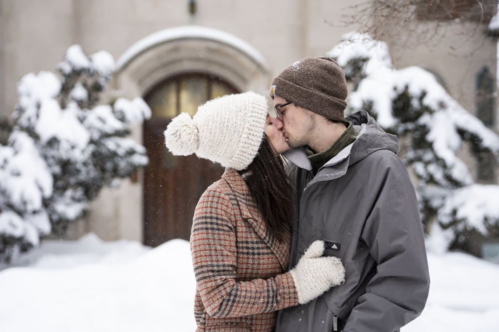 <p>Photo illustration of Taylor and Christian Halquist at the Beaumont Tower in East Lansing, Michigan, on Feb. 3, 2022.</p>