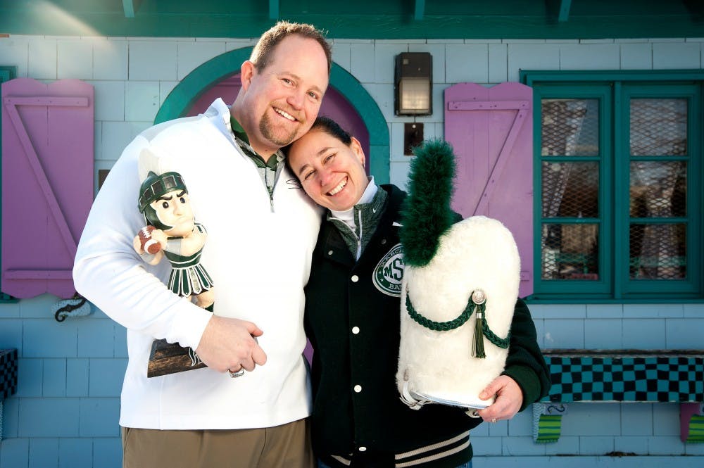 Alumnus and former Sparty Kris Hulliberger, left, and alumna and former drum major Mary Hulliberger pose for a portrait on Feb. 6, 2016 at the 4-H Children's Garden. 