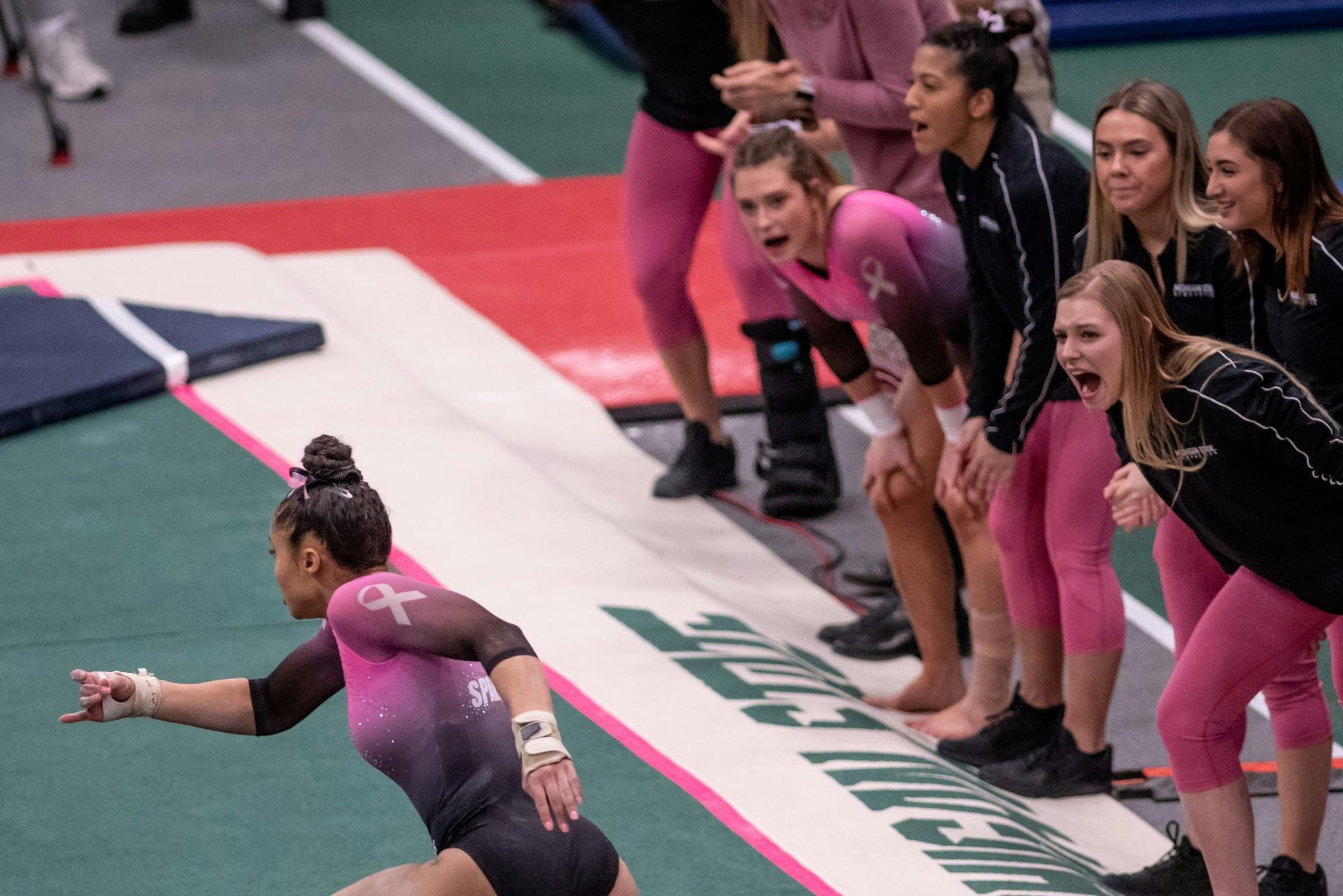 <p>Junior Lea Mitchell runs during her floor routine during the meet against Ohio State on Jan. 18 at Jenison Fieldhouse. The Spartans defeated the Buckeyes, 195.450-195.325.</p>