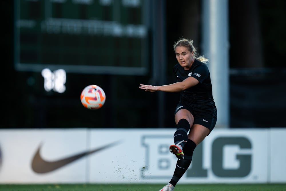 <p>Graduate student defender Samantha White (31) kicks the ball at DeMartin Stadium on Sept. 22, 2022. Spartans tied with the Hawkeyes with a score of 0-0. </p>