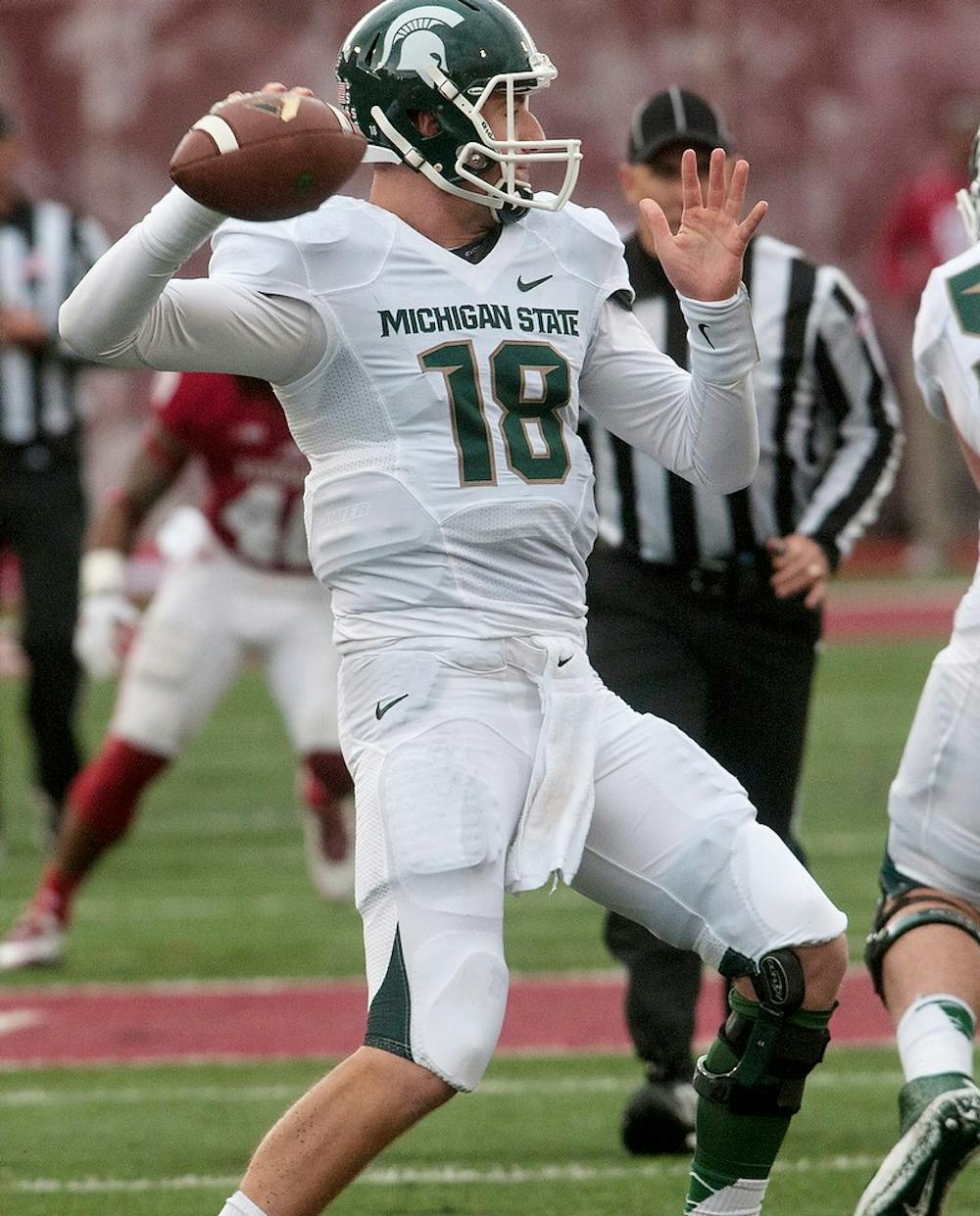 <p>Junior quarterback Connor Cook attempts to make a pass during the game against Indiana on Oct. 18, 2014, at Memorial Stadium in Bloomington, Ind. The Spartans defeated the Hoosiers, 56-17. Raymond Williams/The State News</p>