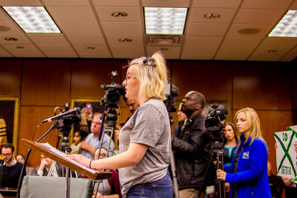 Political science senior, Anna Cumming addresses the board on Dec 15, 2017 at the Hannah Administration Building. Protesters gathered to address the misconduct of MSU’s handling of the Larry Nassar investigation.