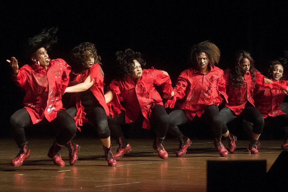 <p>Members of Delta Sigma Theta sorority perform Feb. 28, 2015, during the 2015 Annual Step Show at Wharton Center. Their theme was the Walking Reds and they won over the other two sororities in the competition. Three sororities and three fraternities from the National Pan-Hellenic Council competed in the event. Allyson Telgenhof/The State News</p>