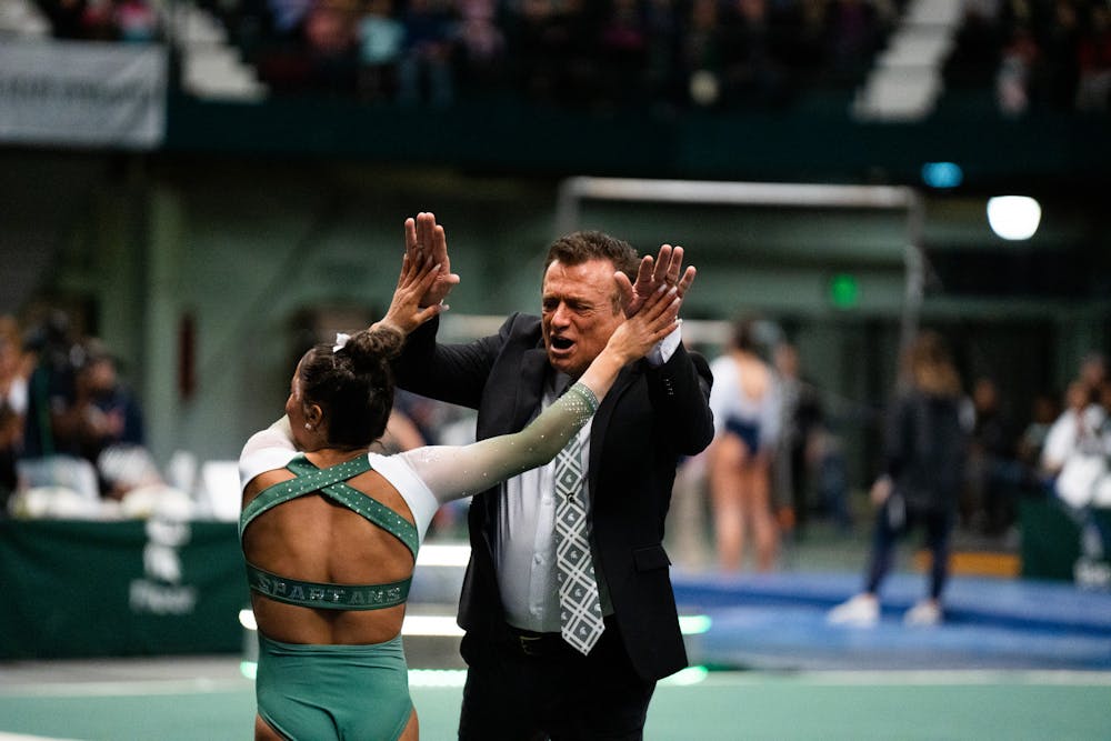 <p>Head coach Mike Rowe at the MSU vs. Penn State meet at the Jenison Field House on Feb. 4, 2023. The Spartans beat the Nittany Lions 197.450 - 195.475.</p>
