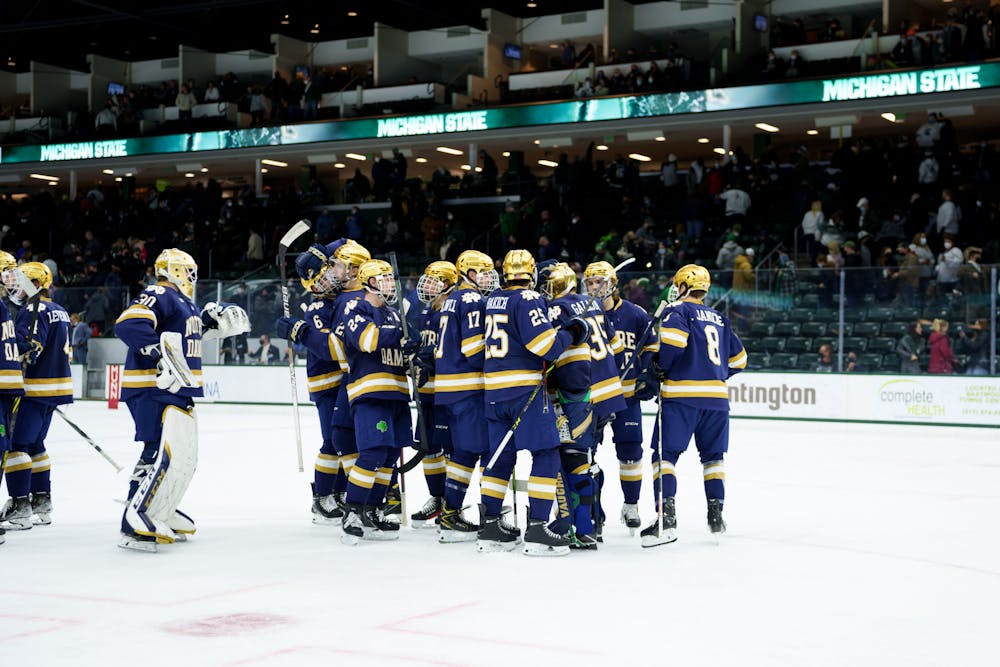 <p>Notre Dame players all patting their goalie, graduate student Mathew Galajda, to celebrate a successful win against the Spartans on Feb. 18, 2022. Spartans lost 2-1 against Notre Dame.</p><p><br/><br/><br/><br/><br/><br/></p>