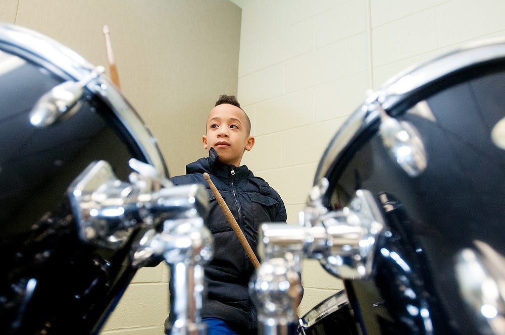 	<p>Grand Ledge resident, Denali Smith, 7, plays the drums at the student open house of the <span class="caps">MSU</span> Community Music School Jan. 3, 2013. Smith&#8217;s older brother will be taking music therapy classes when the new semester starts. Katie Stiefel/The State News</p>