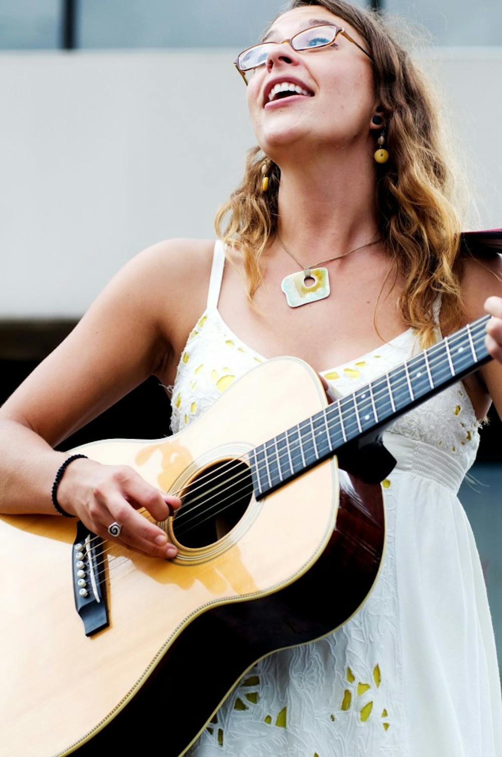 	<p>Lansing singer-songwriter Lindsay Lou performs Aug. 14 on the street at the Great Lakes Folk Festival. This annual festival takes place from Aug. 12-14 this year.</p>