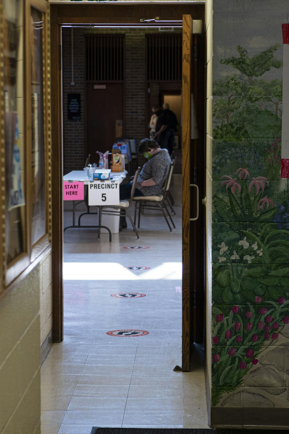 <p>Volunteers at Precinct 5, located in Shaarey Zedek Congregation, wait for the crowds on Election Day. Shot on Nov. 3, 2020.</p>