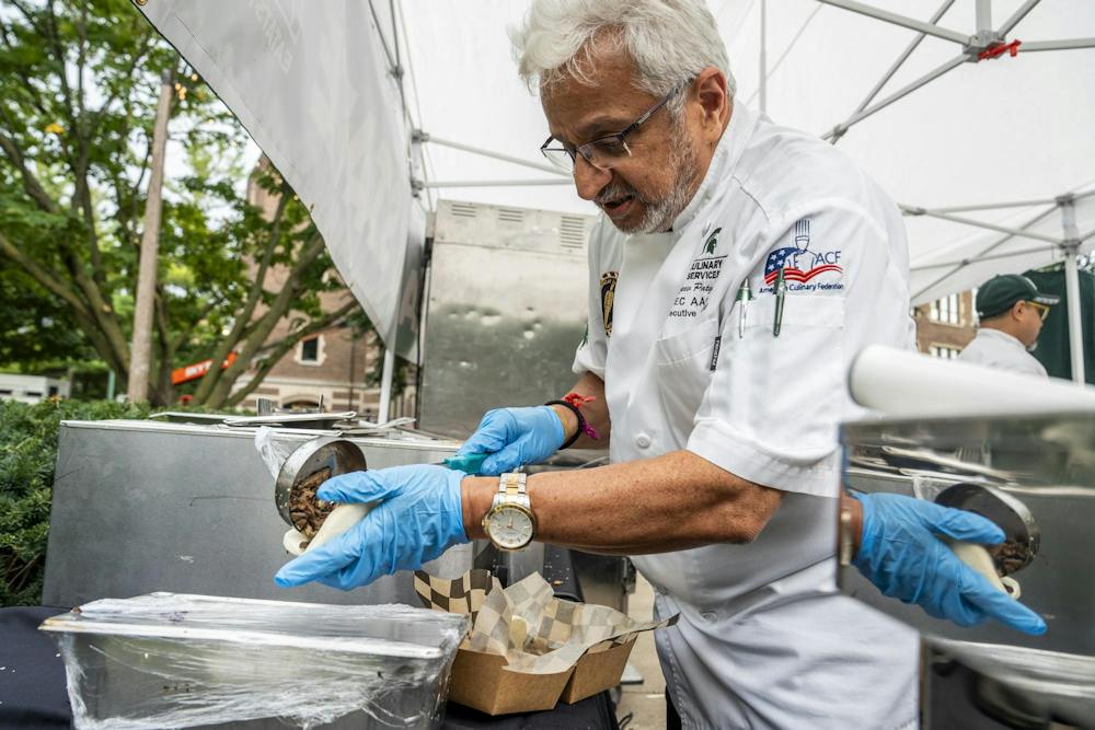 <p>MSU Culinary Services Senior Executive Sous Chef Rajeev Patgaonkar prepares handheld tacos for a customer in the MSU Union courtyard in East Lansing, Mich., on Wednesday, Sept. 16, 2026.</p>