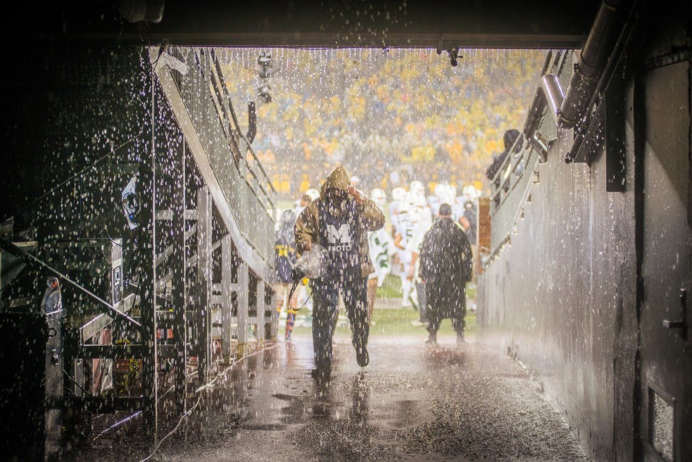 <p>rain pours down over the tunnel to the field during &nbsp;the game against Michigan on Oct. 7, 2017 at Michigan Stadium. The Spartans defeated the Wolverines, 14-10.</p>