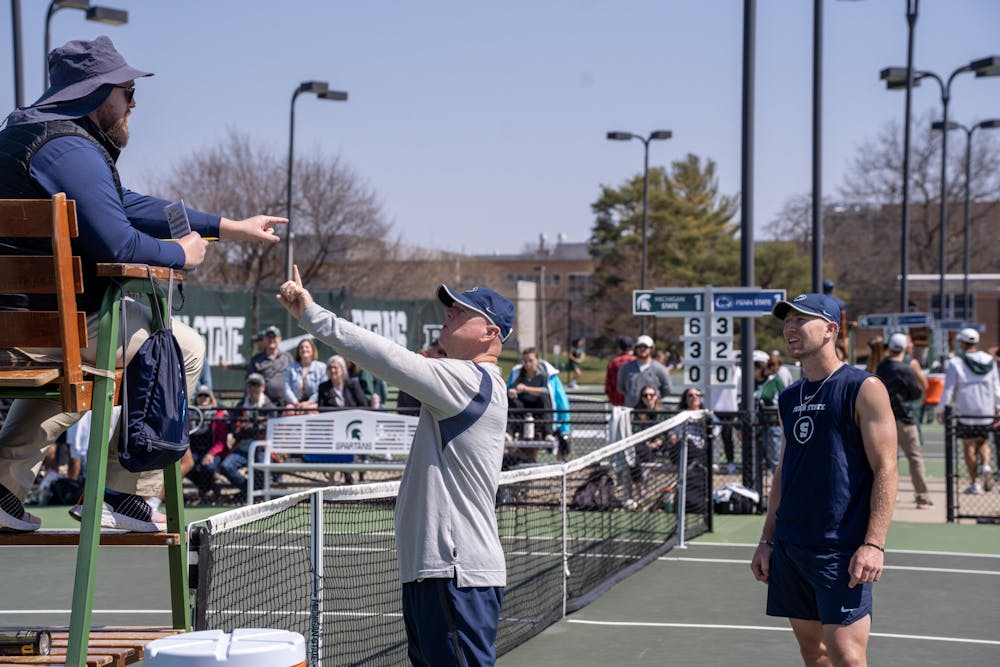 <p>Penn State men's tennis coach Jeff Zinn argues with the official during a single match against Michigan State on April 9, 2023.</p>