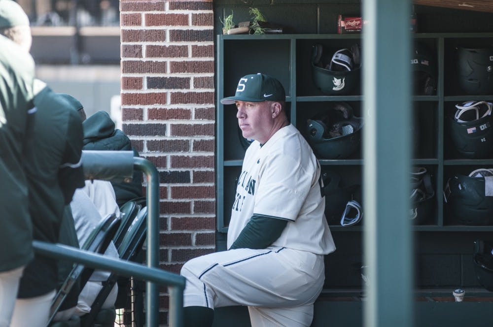 <p>Head Coach Jake Boss Jr. watches during the game against Niagara on March 18, 2018 at McLane Baseball Stadium. The Spartans fell to the Purple Eagles, 12-10. (C.J. Weiss | The State News)</p>