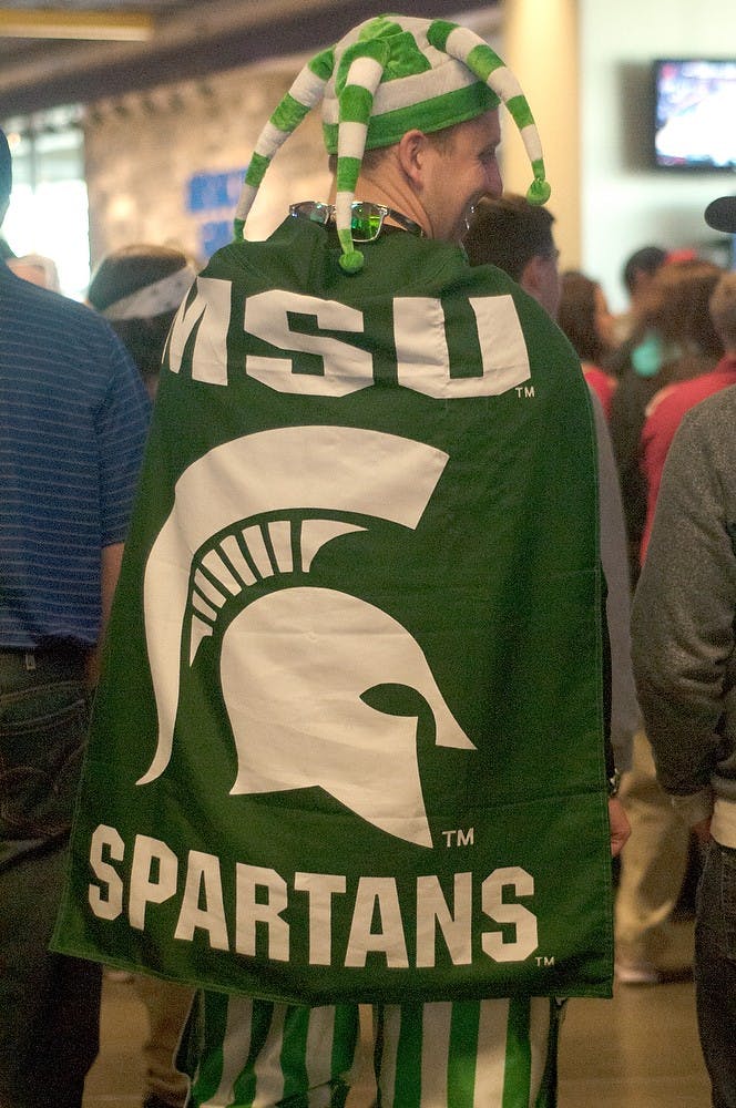 <p>Spokane, Wash., resident and MSU alum John Legg walks around Spokane Veterans Memorial Arena on March 20, 2014. He moved to Spokane after graduation. Betsy Agosta/The State News</p>