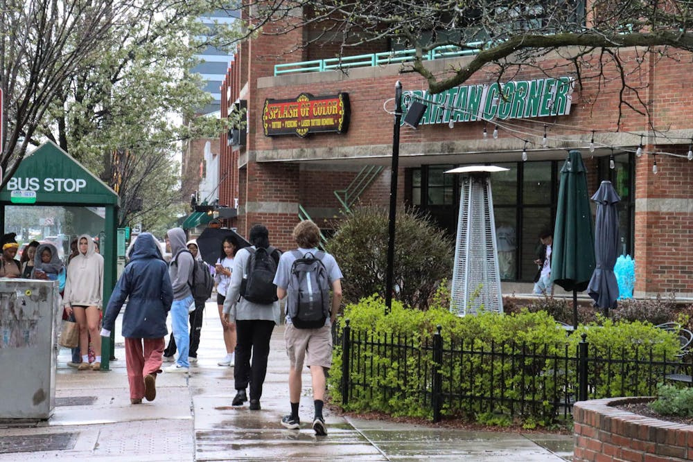 <p>Even with heavy rain, wind speed and dark skies, the severe weather alerts did not stop MSU students, on Grand River Ave, April 17, 2024.</p>