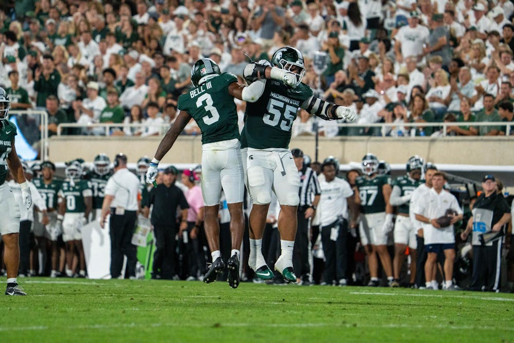 <p>Tre Bell (3) and Ben Roberts (55) of MSU celebrate after a play during the Michigan State vs. Toledo football game at Spartan Stadium in East Lansing, Mich., on Friday, Sept. 4, 2026.</p>