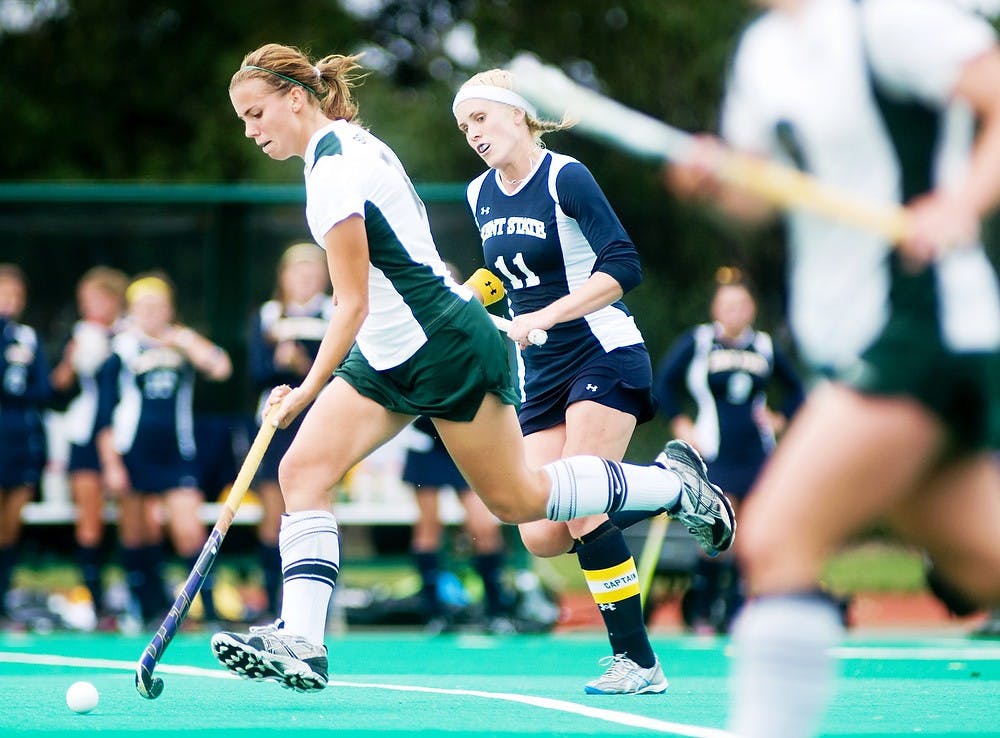 	<p>Then-freshman midfielder Becky Stiles maintains possession of the ball against Kent State back Carla Johl on Sept. 25, 2011, at Ralph Young Field. </p>