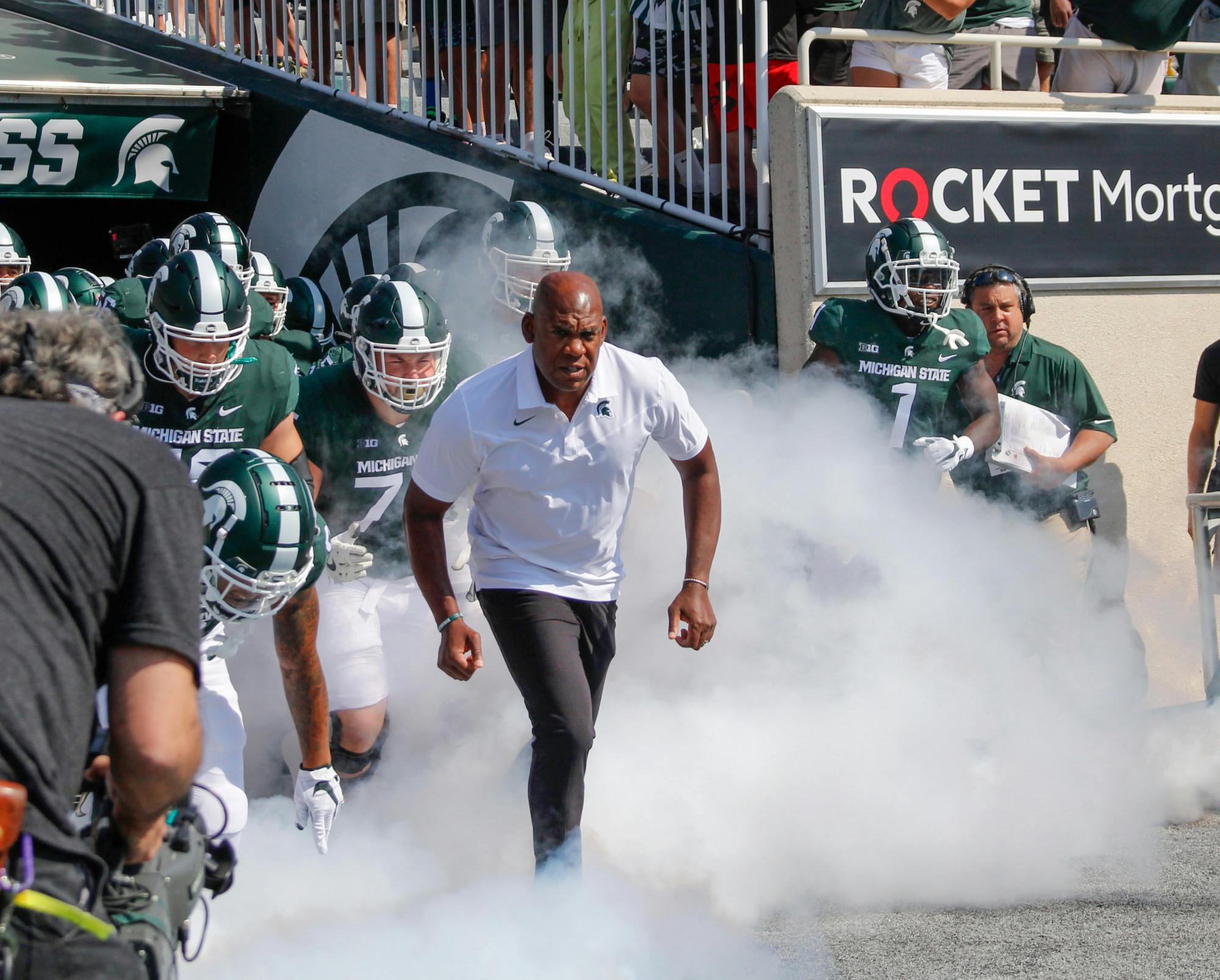 <p>Head coach Mel Tucker leads the team onto the field ahead of their home opener for the 2021 season. Photographer on Sept. 11, 2021.</p>