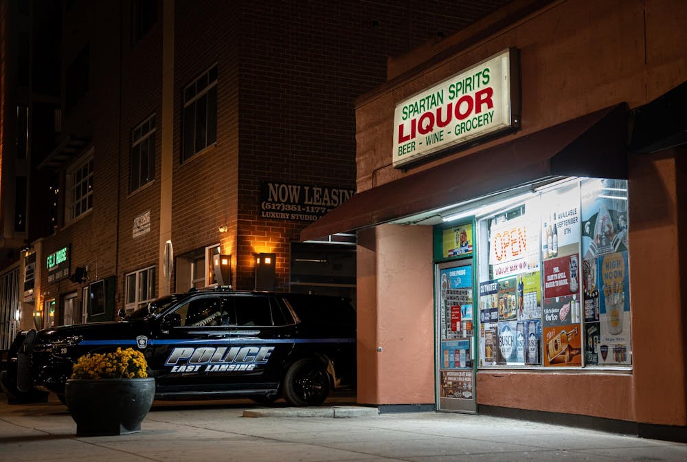 An ELPD officer sits in his car outside Spartan Spirits Liquor on October 2, 2025.