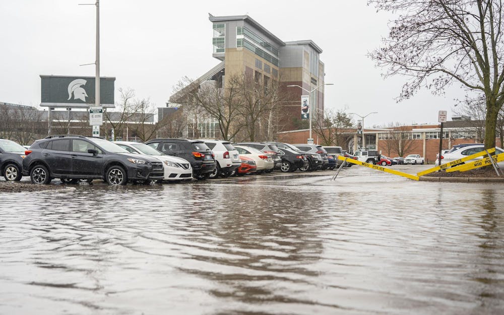 The IM West parking lot fills with water on Wednesday, April 5, 2023, during a period of heavy rains. 