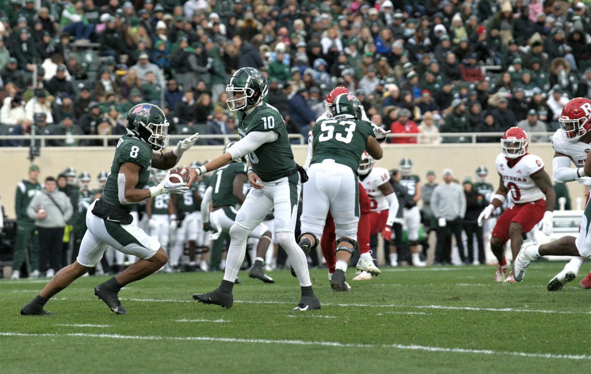 <p>Quarterback #10 Payton Thorne hands off the ball to #8 Jalen Berger ﻿during the matchup against Rutgers on Nov. 12, 2022. </p>