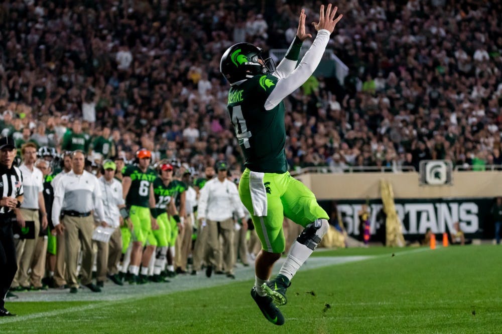 <p>Senior quarterback Brian Lewerke catches a pass against Western Michigan. The Spartans lead the Broncos, 31-7, at Spartan Stadium on September 7, 2019. </p>
