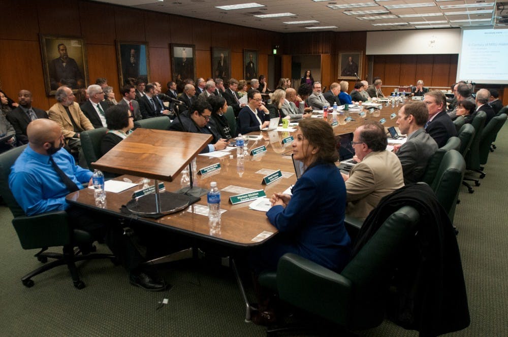An overview of the table during an MSU board of trustees meeting on Feb.19, 2016 at the Hannah Administration Building. During the meeting, members of the board discussed various topics, including the University's efforts to help the individuals dealing with the water crisis in Flint.
