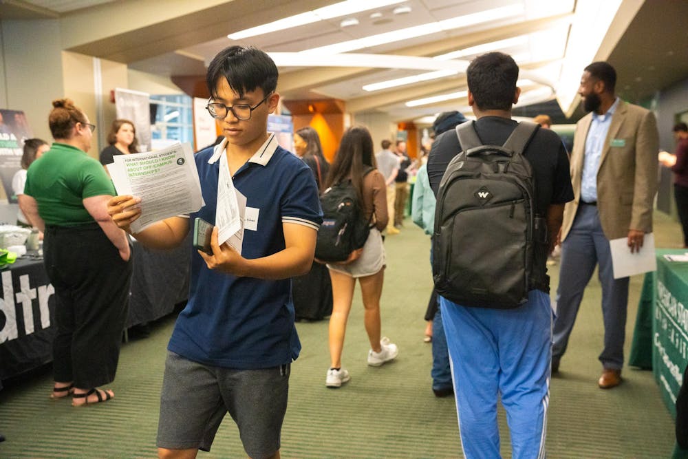 <p>Students making their way through the booths at the MSU Local Job and Internship Fair held at the Spartan Stadium Office Tower on Sep 7, 2023.</p>
