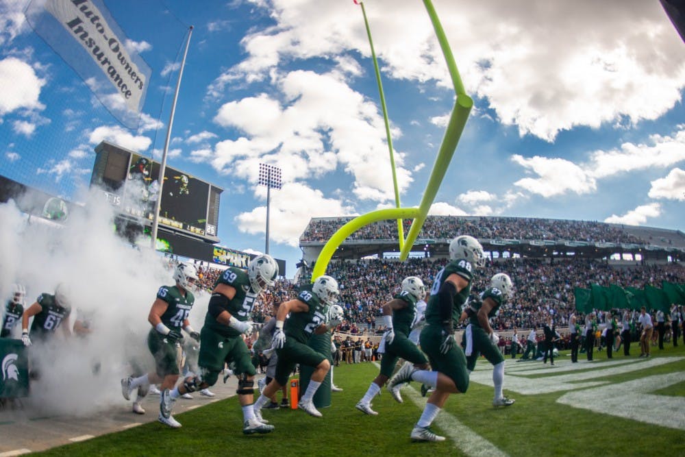The Spartans take the field before the game against Central Michigan at Spartan Stadium on Sept. 29, 2018. The Spartans defeated the Chippewas 31-20.