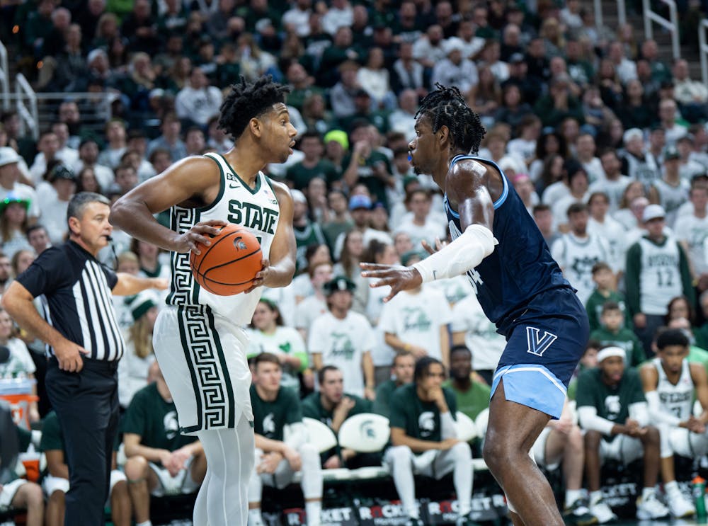 <p>Junior guard A.J. Hoggard (11) looks at his opponent before passing the ball during a game against Villanova at the Breslin Center on Nov. 18, 2022. The Spartans defeated the Wildcats 73-71. </p>