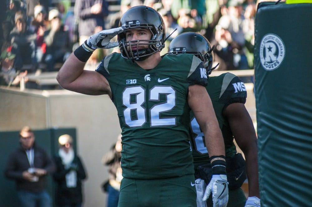 Senior tight end Josiah Price (82) celebrates after catching a touchdown pass in the first quarter during the game against Rutgers on Nov. 12, 2016 at Spartan Stadium. Price received a 2-yard touchdown pass which resulted in the score being 6-0.