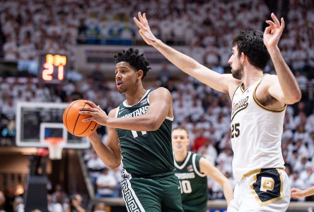 <p>Junior guard A.J. Hoggard (11) about to pass the ball to his teammate during a game against Purdue at Mackey Arena on Jan. 29, 2023. The Spartans lost to the Boilermakers 77-61. </p>