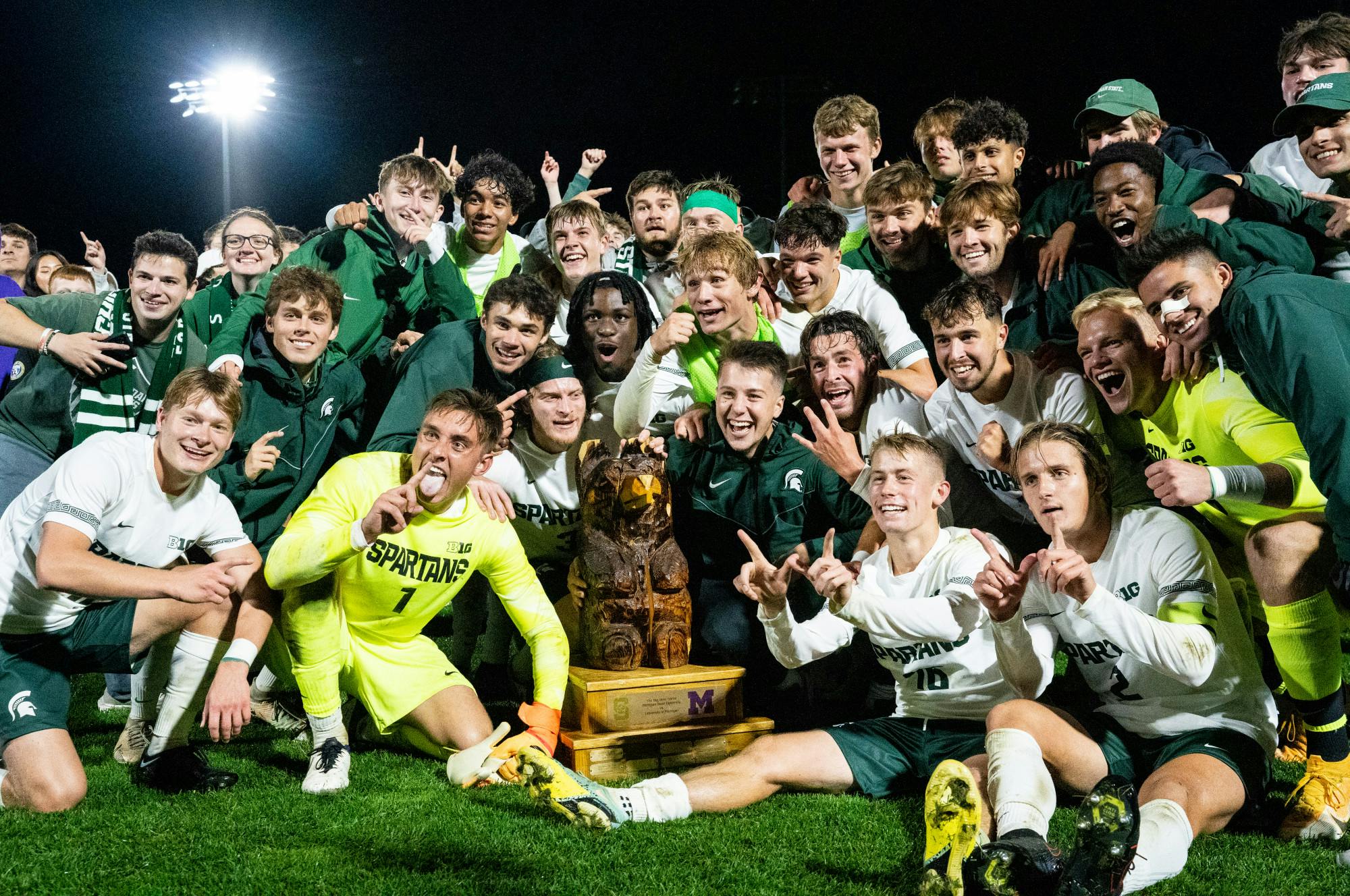 <p>The MSU men&#x27;s soccer team poses with the Big Bear trophy after defeating the University of Michigan men&#x27;s soccer team at DeMartin Stadium on Sept. 27, 2022. Spartans defeated the Wolverines 2-0. </p>