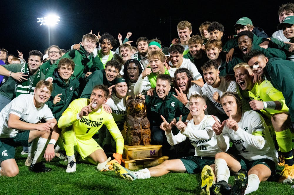 <p>The MSU men&#x27;s soccer team poses with the Big Bear trophy after defeating the University of Michigan men&#x27;s soccer team at DeMartin Stadium on Sept. 27, 2022. Spartans defeated the Wolverines 2-0. </p>