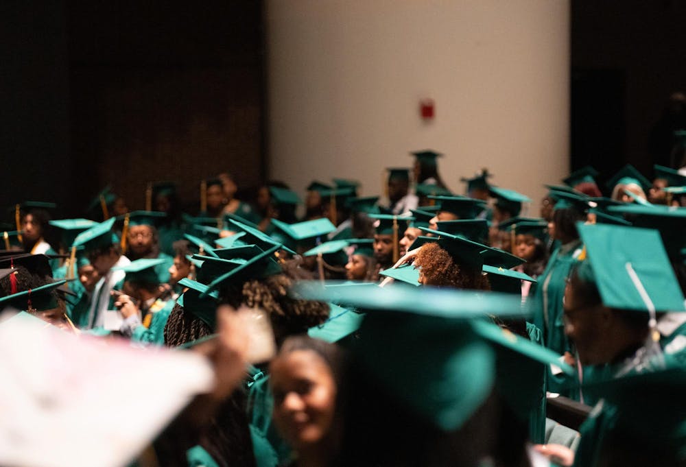 Michigan State students stand before the Black Graduation ceremony at the Wharton Center on April 21, 2024.