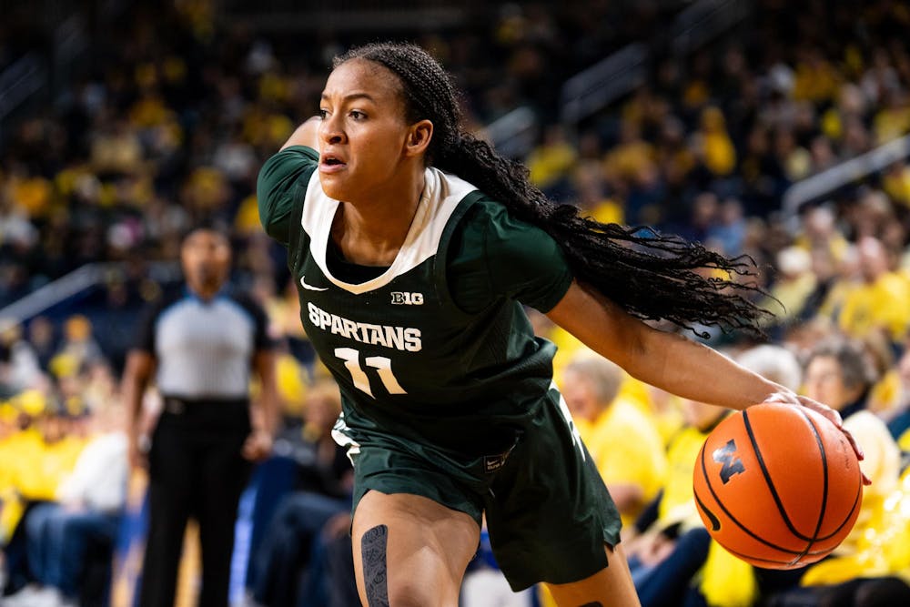 Michigan State junior guard/forward No. 11 Jocelyn Tate drives the net at the Crisler center in Ann Arbor, Feb. 18, 2024. Michigan State secured a season sweep of the rival Wolverines, breaking a two-game losing streak in the process.