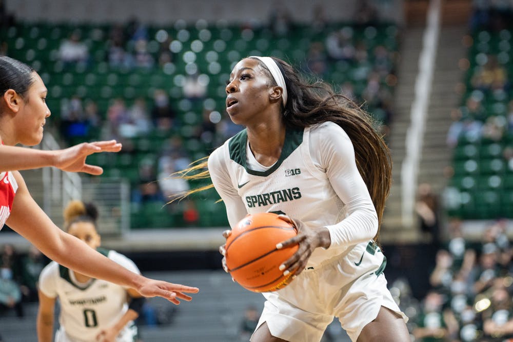 <p>Graduate student forward Tamara Farquhar (2) takes on a defender. The Spartans lost 61-55 against Ohio State University at the Breslin Center on Feb. 27, 2022.</p>