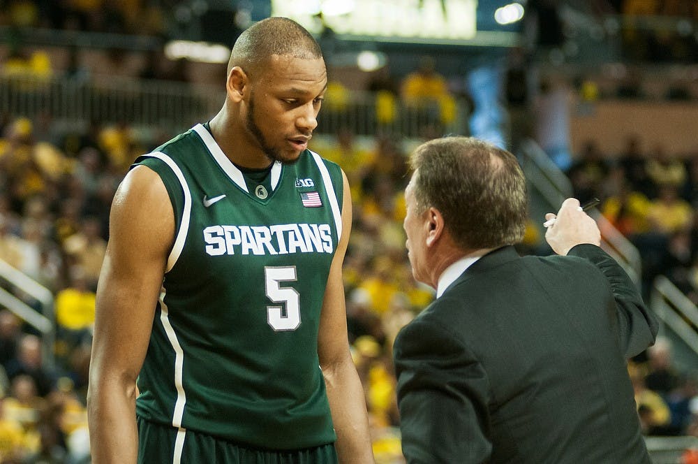 	<p>Head coach Tom Izzo talks with senior center Adreian Payne during the game against Michigan on Feb. 23,  2014, at Crisler Center in Ann Arbor, Mich. The Spartans were defeated by the Wolverines, 79-70. Danyelle Morrow/The State News</p>