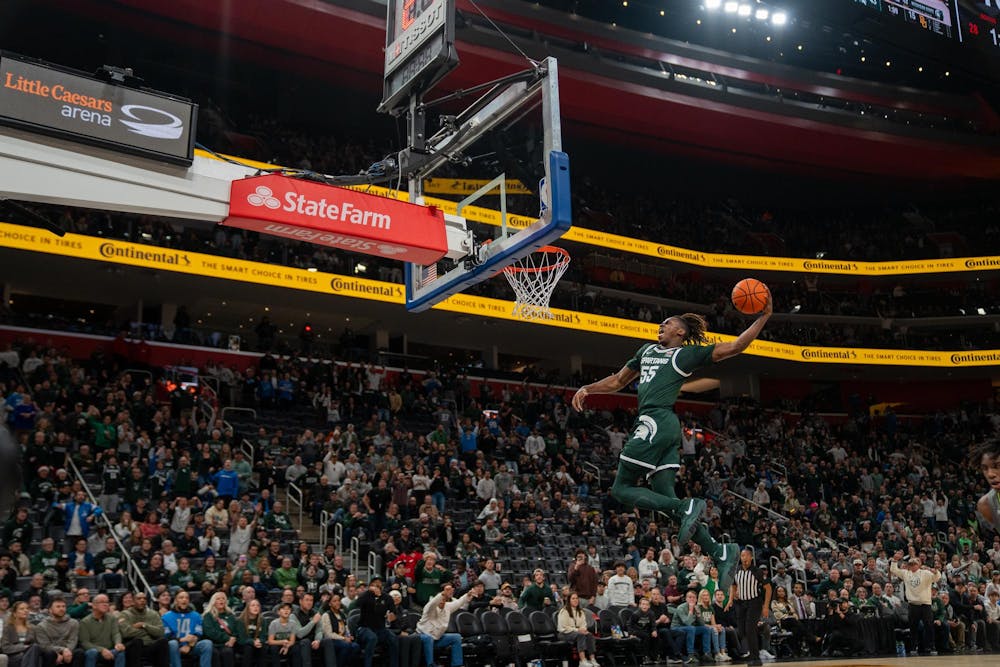 <p>Freshman forward Coen Carr (55) preparing to dunk the ball during a game against Baylor University at the Little Caesar’s Arena on Dec. 16, 2023. Carr would make the dunk attempt, helping the Spartans to a half-time lead of 45-17.</p>