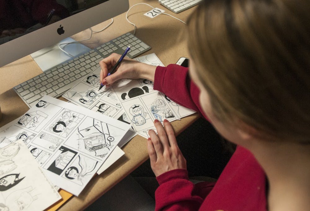 Media and Information senior Miranda McClellan works on comics during class on Feb. 13, 2017 at Urban Planning and Landscape building. 