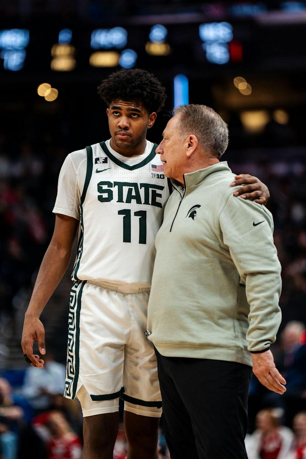 <p>Michigan State freshman guard Jase Richardson (11) speaks with men's basketball head coach Tom Izzo during the Big Ten Conference Tournament at Gainbridge Fieldhouse in Indianapolis on March 15, 2025. Michigan State lost to Wisconsin 77-74.</p>