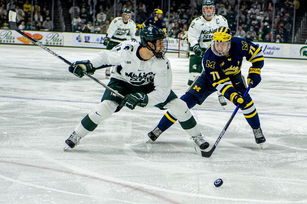 <p>Sophomore forward Jeremy Davidson races toward the puck during the Spartans 3-2 loss to the Wolverines on Nov. 6, 2021.</p>