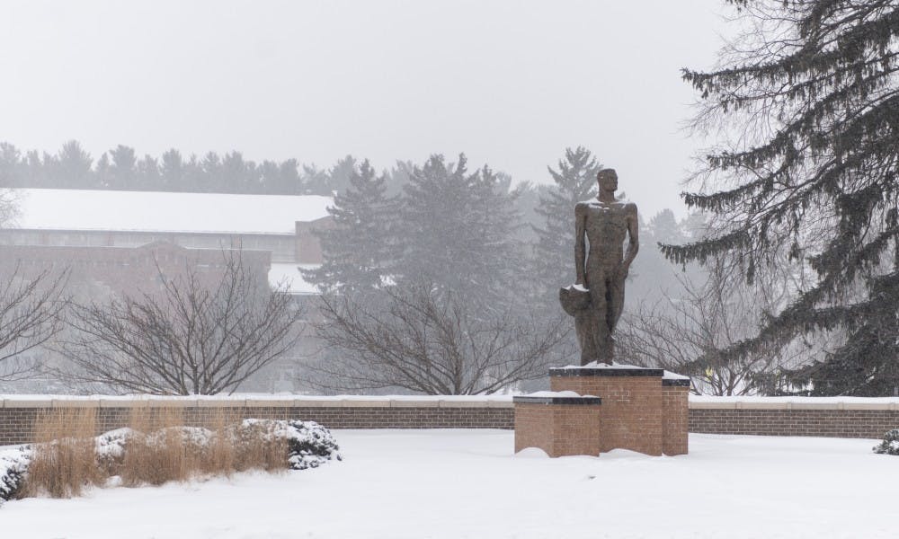 <p>The Spartan Statue gets a dusting of snow on Jan. 28, 2019. Lansing Mayor Andy Schor declared a snow emergency on the same day due to the inclement weather.</p>