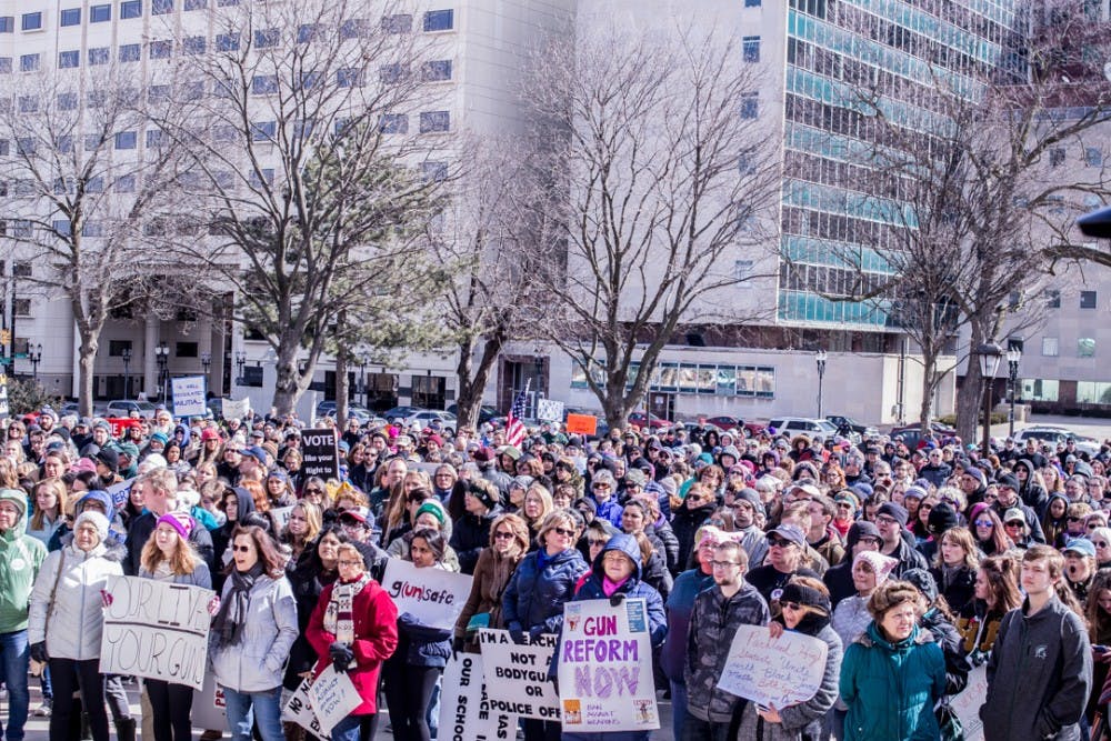 A crowd of people listen to speakers during the March for Our Lives on March 24, 2018 at the Michigan State Capitol. 