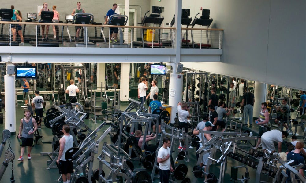 <p>People exercise on Sept. 3, 2015, at IM Sports-West. Jack Stephan/The State News</p>