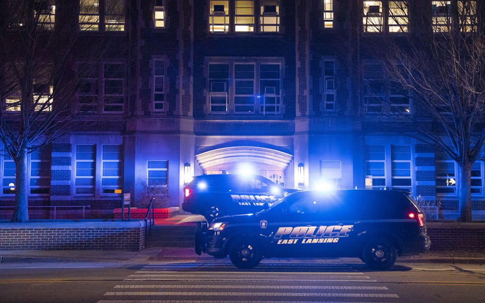 East Lansing Police park outside Berkey Hall after the mass shooting on Monday, Feb. 13, 2023 in Michigan State University’s North Neighborhood.