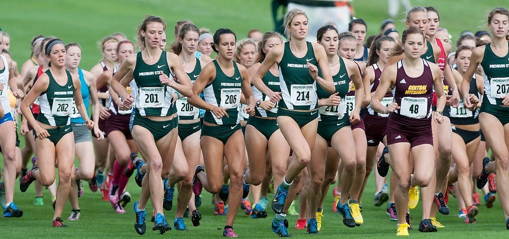 <p>The Spartan cross country team competes during the Spartan Invitational on Sept. 12, 2014, at Forest Akers East Golf Course, 2280 South Harrison Road, in East Lansing, Mich. Junior runner Leah O'Connor finished in first place for the Spartans with a time of 21:03. Aerika Williams/The State News</p>
