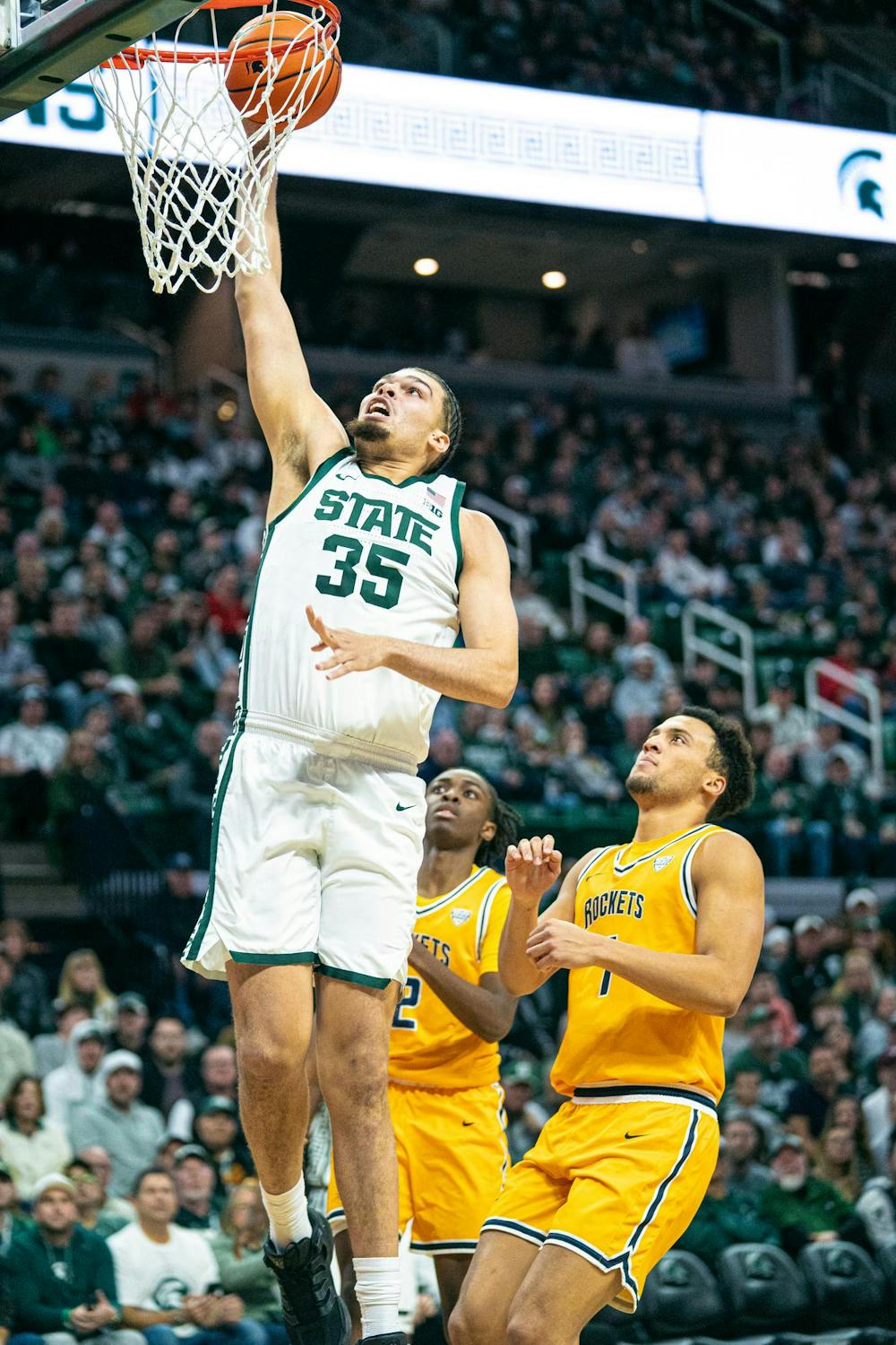 <p>Two Toledo guards watch helplessly MSU red-shirt freshman, Jesse McCulloch (35) jumps for a layup during the MSU versus Toledo matchup at the Breslin Center in East Lansing, Michigan on Tuesday, Dec. 16, 2025.</p>