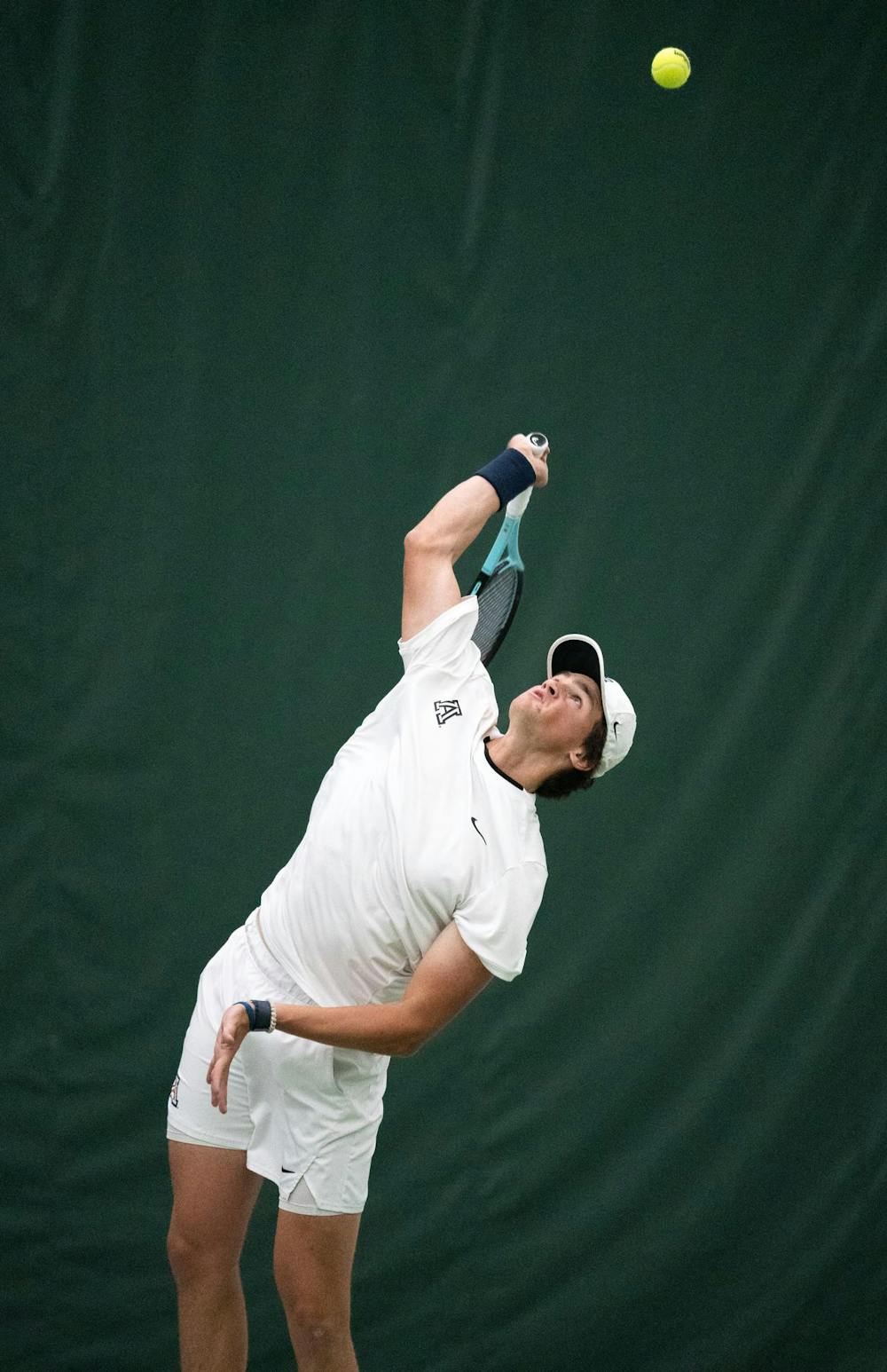<p>Arizona junior Eric Padgham serves the ball at the MSU Tennis Facility on Mar. 12, 2025.</p>