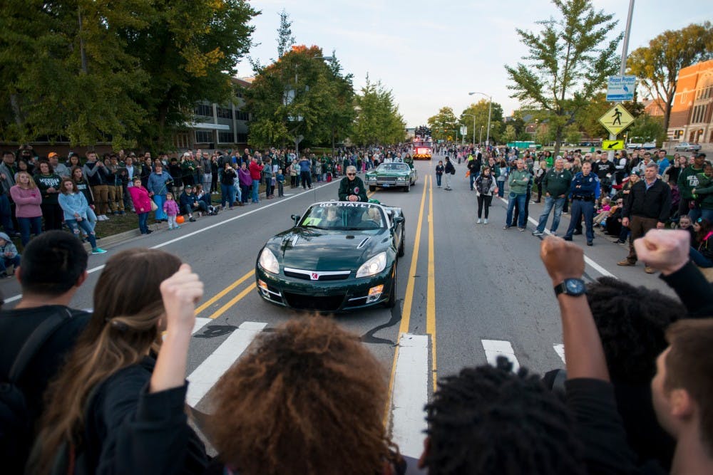 A group of protesters stop MSU President Lou Anna Simon during the Homecoming Parade on Oct. 14, 2016 along Farm Lane. The protesters were in support of Black Lives Matter.