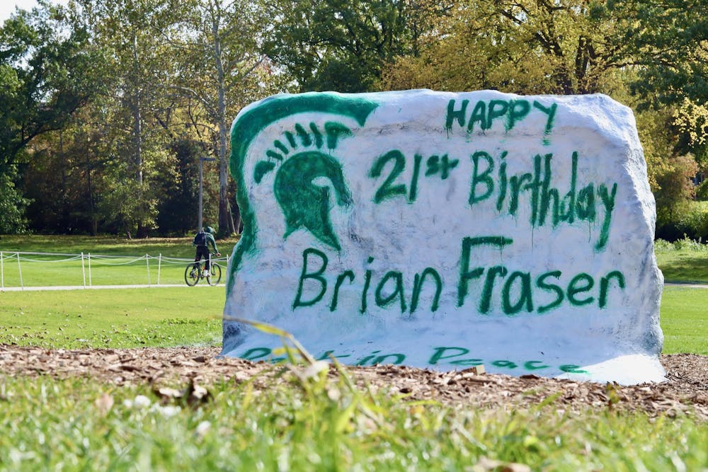 Brian Fraser's fraternity brothers from Phi Delta Theta paint The Rock on Oct. 18, 2023, in memory of Fraser's twenty-first birthday. 